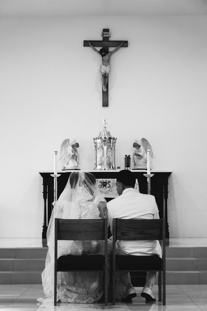 A couple before an altar, black and white
